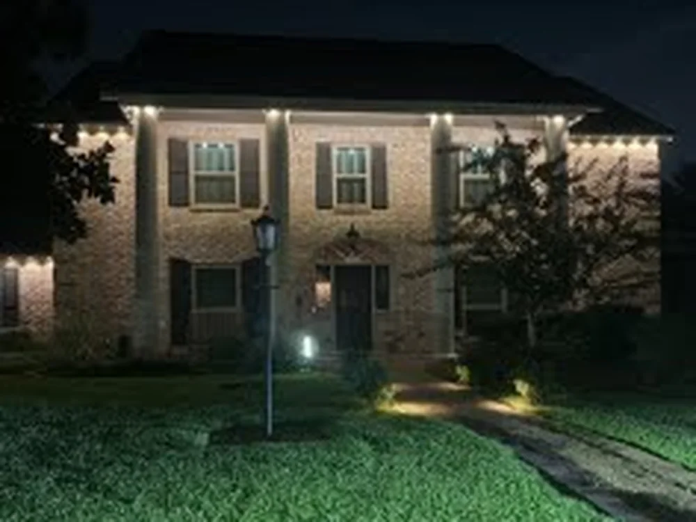 A Spring, Texas home with BrightSky permanent roofline lighting at dusk